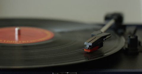 Vinyl Record playing on turntable in reverse - slow motion