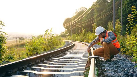 Railway engineer checks the new railway line