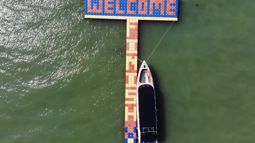 pier in the sea, parked boat