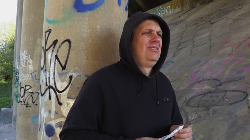 Troubled dealer waits for a client