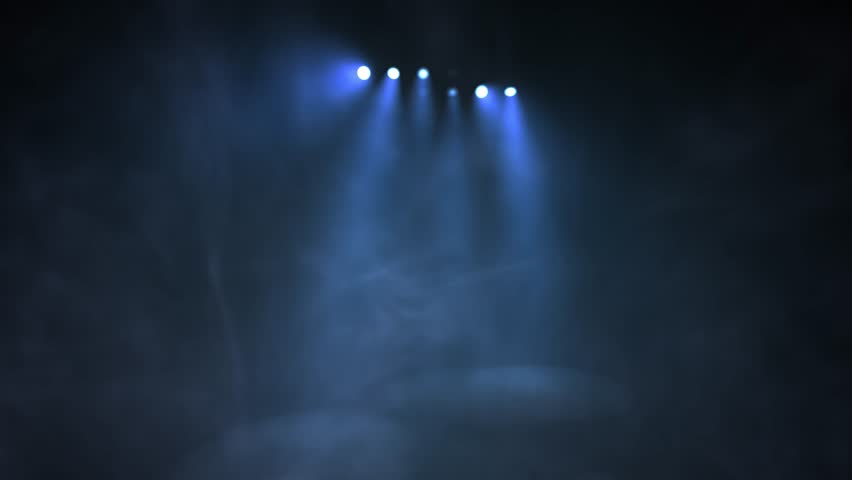 Stage lights flashing at podium.
