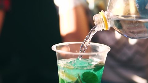 Barman makes a cocktail