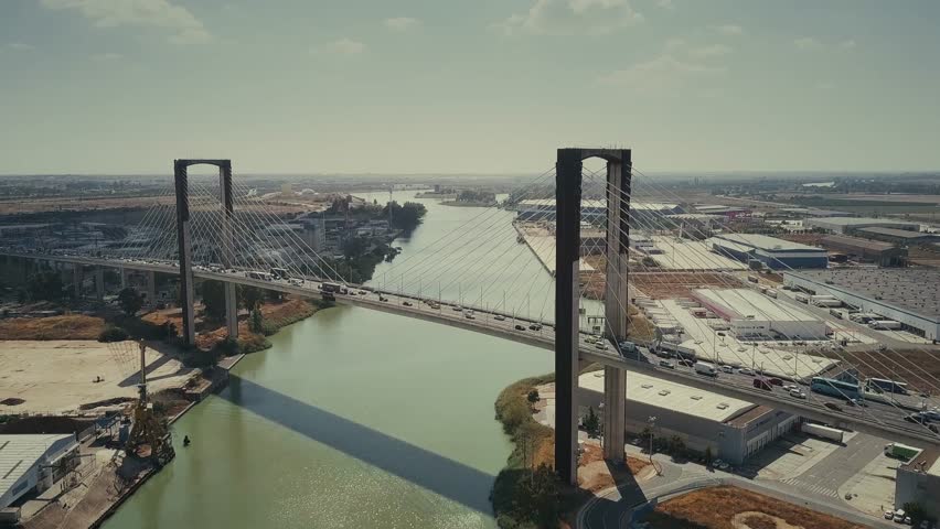 Aerial view of cable-stayed Centennial Bridge in Sevilla, Spain Royalty-Free Stock Footage #1017500173