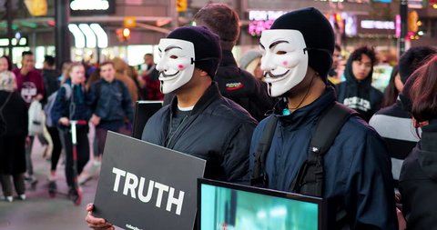 Toronto, Canada - October 5, 2018: Masked Anonymous for the Voiceless activists protest animal exploitation at Yonge and Dundas Square in Downtown Toronto, Ontario, Canada. 