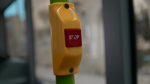 Bus stop Botton pressed in slow motion 