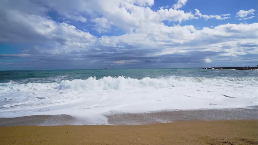 Beach of Barcelona with clouds