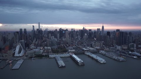 New York City Circa-2015, wide angle aerial view of Midtown Manhattan skyline from the Hudson River at sunrise.