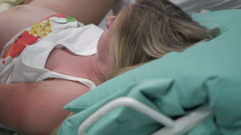 A woman gives birth in a hospital. Real delivery video