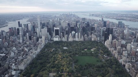 New York City Circa-2015, wide angle aerial view flying over Central Park toward Midtown, featuring the Manhattan Skyline.