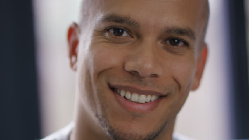 Portrait of attractive mixed race male smiling to camera, in slow motion  | Shutterstock HD Video #1017521539