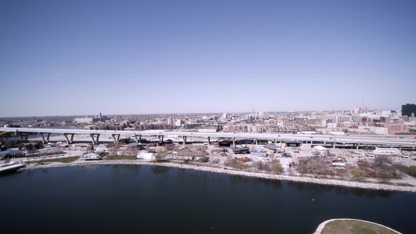 Left to rigtht pan aerial view of south east bride to downtown Milwaukee and lake Michigan.