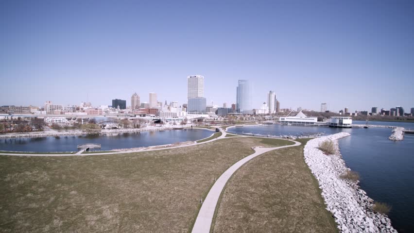 Beautifful right to left aerial view of Downtown Milwaukee city skyline on a bright clear day.