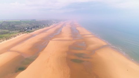 Drone footage - forward aerial shot of Omaha Beach (D-day World War 2) in Normandy France