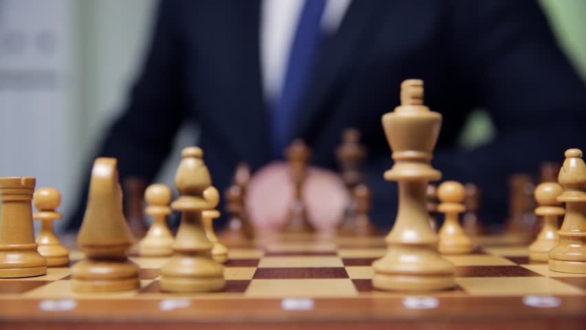 hand of businessman moving chess figure in competition success play. strategy, management or leadership concept Royalty-Free Stock Footage #1017535528