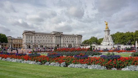 London, United Kingdom - Circa September, 2018: Buckingham Palace viewed from the Royal garden with blooming lavender and rose flower.