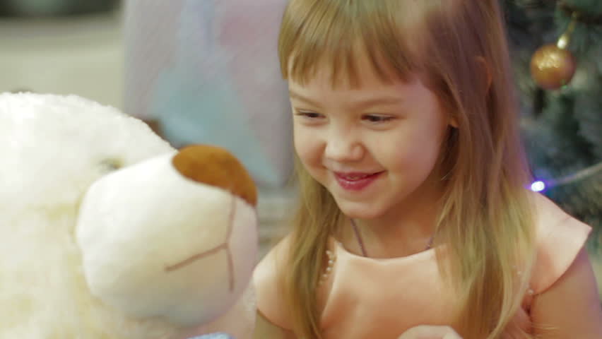 Happy girl with Teddy bear. Present for New Year for child