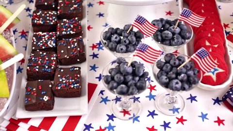 Variety of desserts on the table for July 4th party.の動画素材