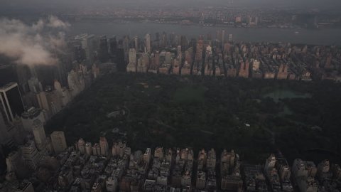 New York City Circa-2015, aerial view of Central Park, the Upper West Side and Midtown skyscrapers at sunrise, under low level clouds
