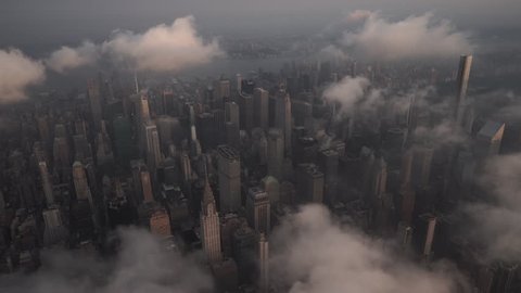New York City Circa-2015, aerial view of Midtown Manhattan at sunrise, featuring famous landmarks under low level clouds
