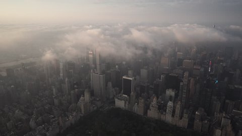 New York City Circa-2015, aerial view of Manhattan skyline at sunrise from Central Park with fog and low level clouds over Midtown and Times Square