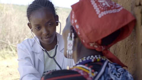 Nurse examining patient. Maasai village. Kenya.