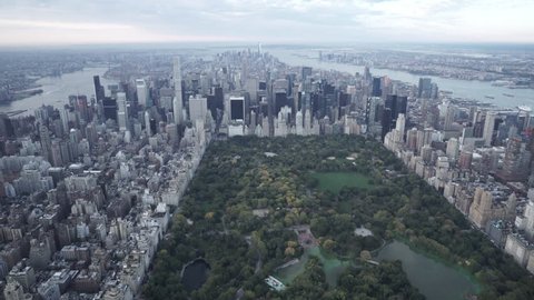 New York City Circa-2015, wide angle aerial view flying over Central Park from north to south, Midtown, featuring the Manhattan Skyline