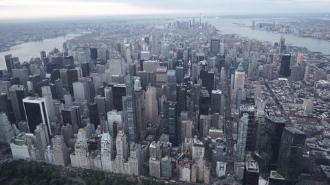 New York City Circa-2015, wide angle aerial view flying over Central Park and Columbus Circle toward Midtown skyscrapers, featuring the Manhattan Skyline, Brooklyn and Jersey City