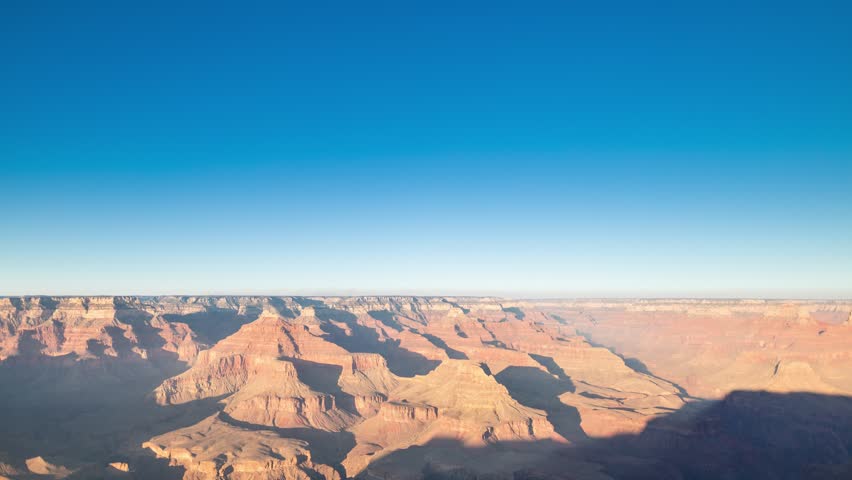 Day to night Sunset time lapse over the Grand Canyon in Arizona, with stars and milky way