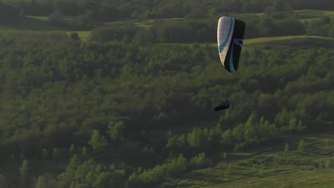 Paraglider flying in the air stream.