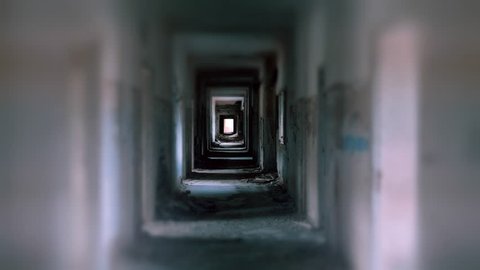 Abandoned destructed long corridor tunnel,tracking motion,pov