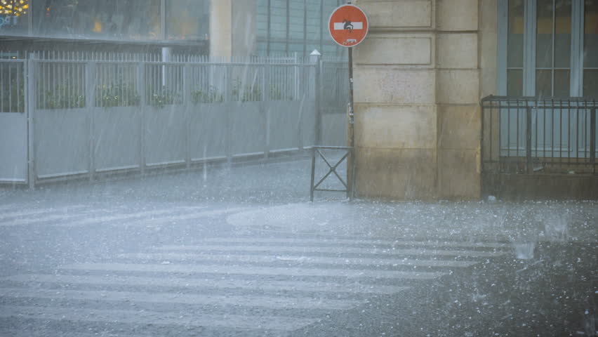 Extreme weather hail rain storm on the streets of Paris