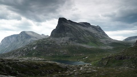 Clouds moving over high mountains peaks. Norwegian Scenic Route Geiranger - Trollstigen. Time lapse