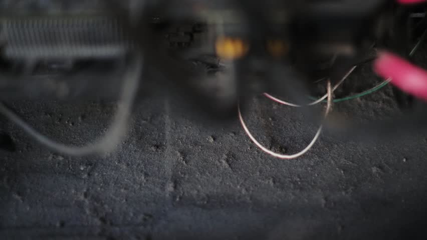 Cleaning old dusty electronics computer, lots of dirt and dust blown by compressed air, old wires and steel, old wires cleaning by proffesional specialist