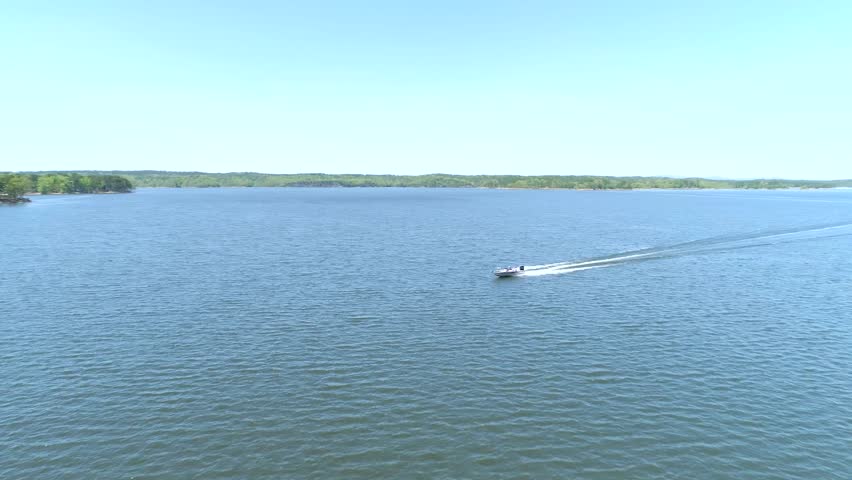 Drone Shot of Speed Boat Racing Across Lake
