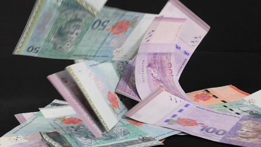 Ringgit Malaysia banknotes in falling on dark background. Slow Motion footage. | Shutterstock HD Video #1017609919