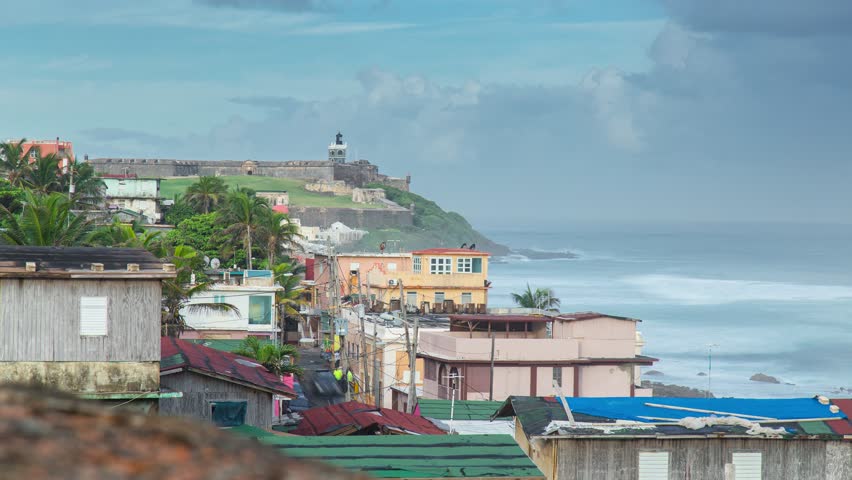 Shanty town favela time lapse on the coast of the old San Juan city, Puerto Rico. Beach and the ocean in the background.

