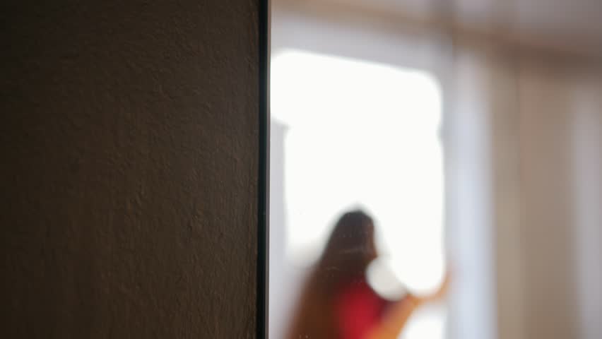 Sexy girl in red dress training her pole dance.