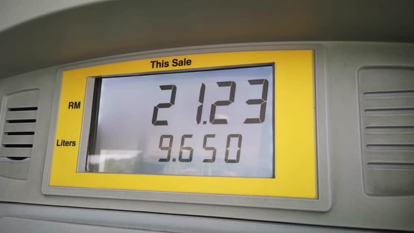 Display shows the amount of fuel in litres and price in Ringgit Malaysia. | Shutterstock HD Video #1017631627