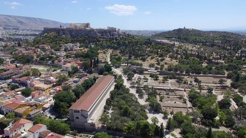 Aerial towards Agora Ruins and the Filopappau Hill of Muses and Acropolis on the Hilly Horizon