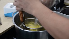 hawker preparing clear soup noodle in asia