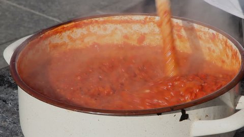 cooking red peppers and tomatoes - a dish called ajvar