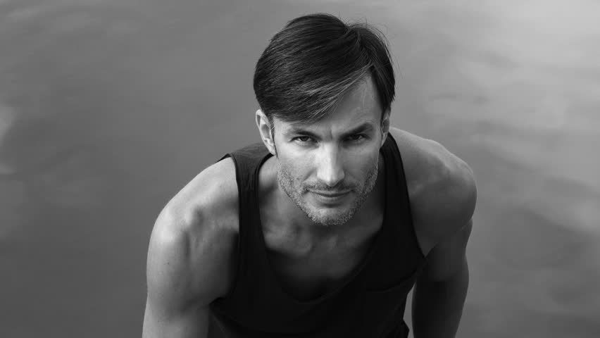 men with a beard goes to the camera, closeup. The age of forty years.