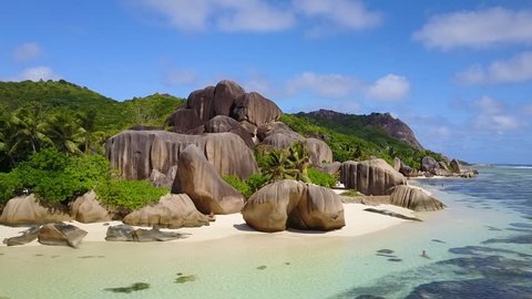 Aerial drone shot of the tropical and beautiful Anse Source D'argent beach in the Seychelles