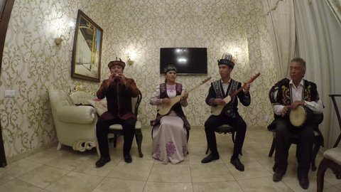 Bishkek, Kyrgyzstan - September 19, 2018 :  Musicians playing traditional Kyrgyz instruments in folk songs.