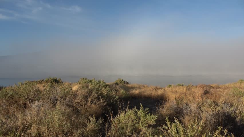 Fog moving through lemmon valley over the lake