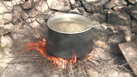 boiling water on the fire