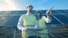 Solar engineers work on a rooftop, close up. - Powered by Shutterstock - Get 15% off with code: PIKWIZARD15