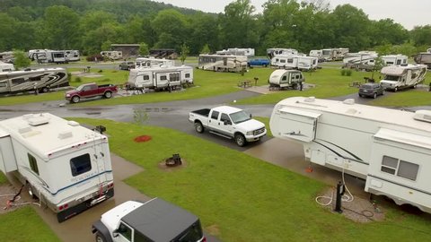 Low angle drone shot of an RV campground and campers.