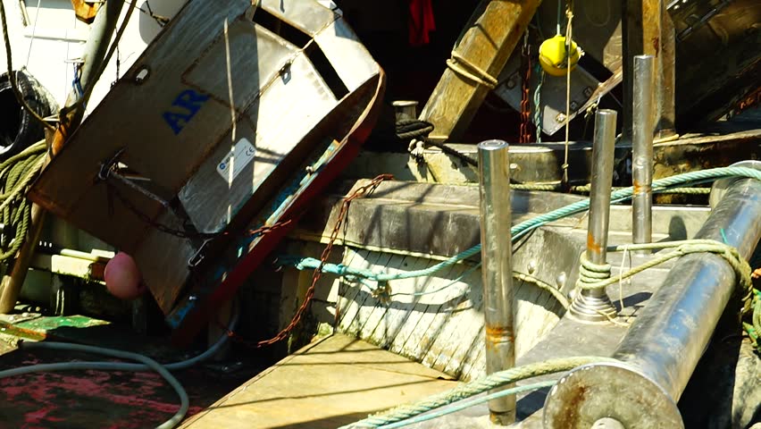 Civitavecchia, Italy - july 29, 2018: Fishing boats moored in the ancient port of Civitavecchia on a summer day