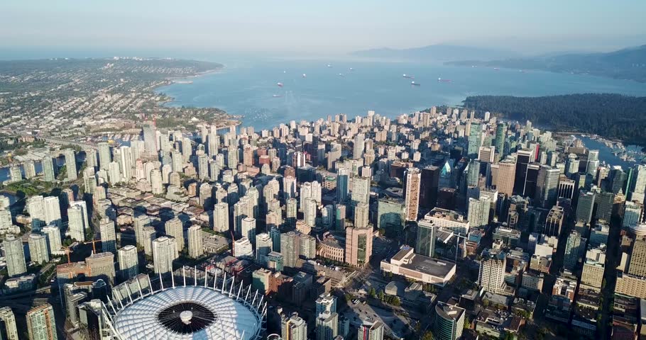 Amazing city aerial overlooking downtown Vancouver on sunny day